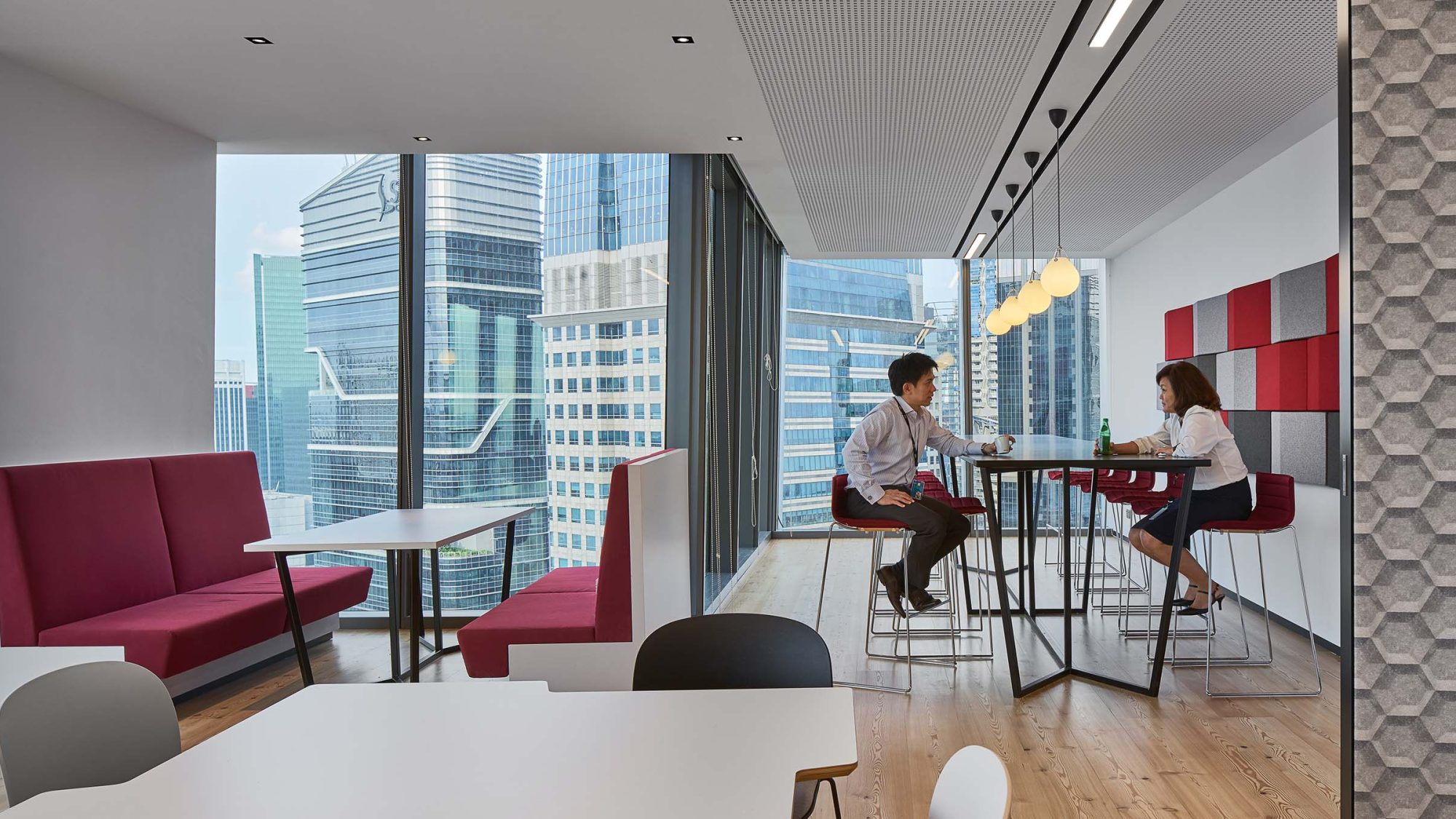 Corporate workplace design featuring a bright and airy kitchen setting for employees to relax.