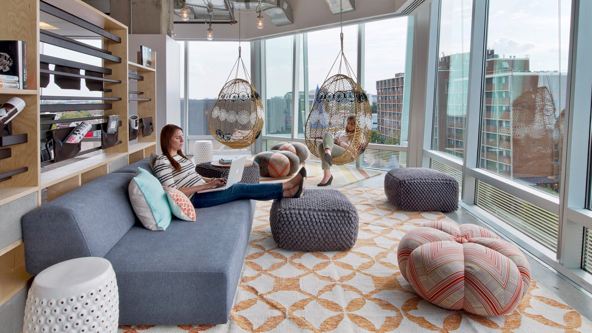 woman relaxing in sofa with hanging chairs