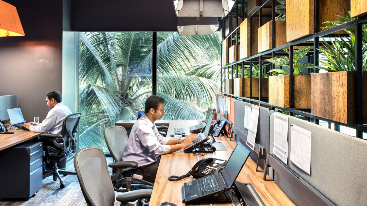 person focusing at open work desk