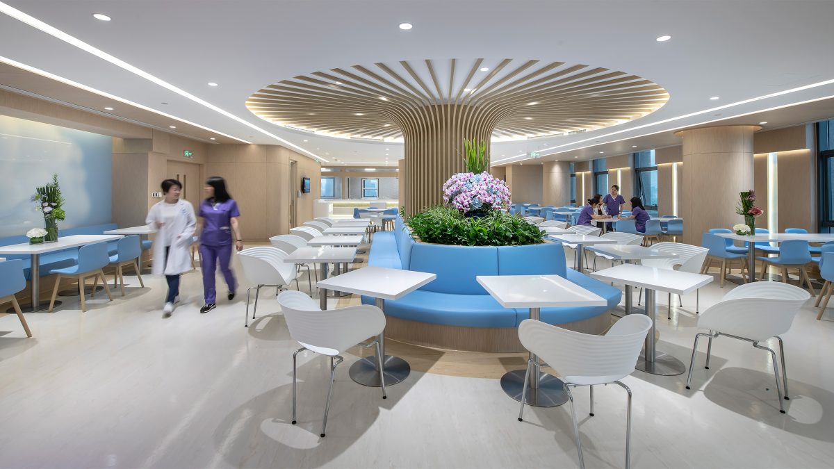 women walking through hospital canteen