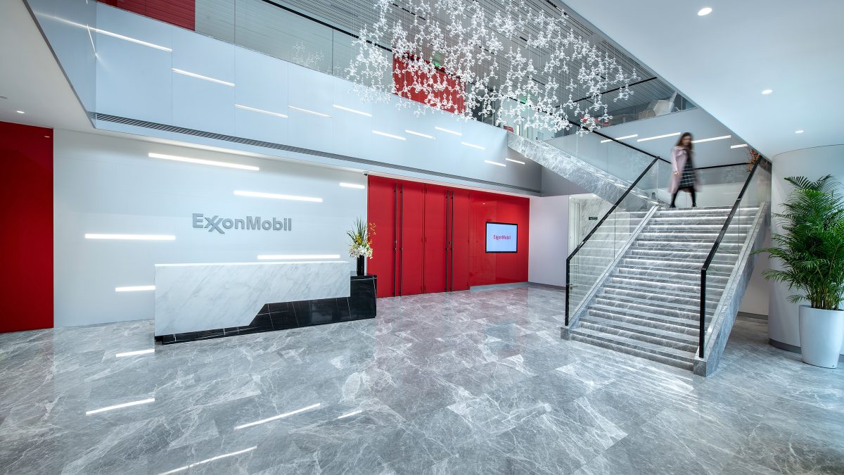 woman walking down staircase into reception