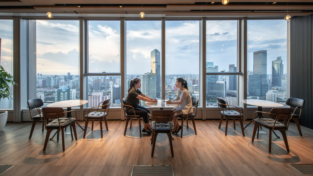 women talking and collaborating at table