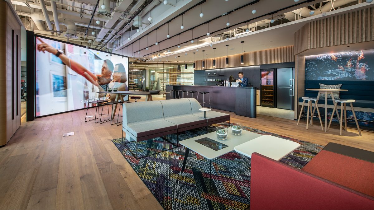 people working in open plan workplace