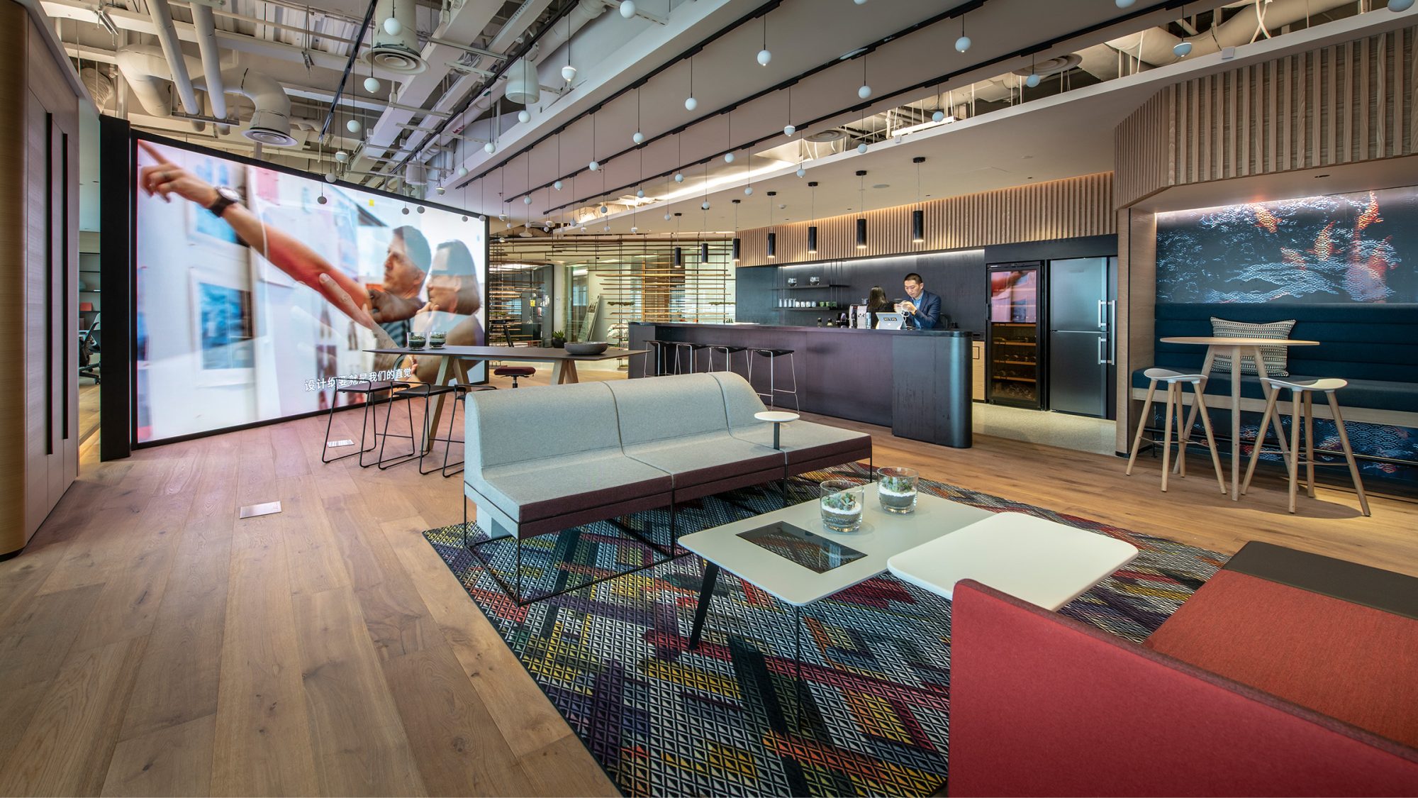 people working in open plan workplace