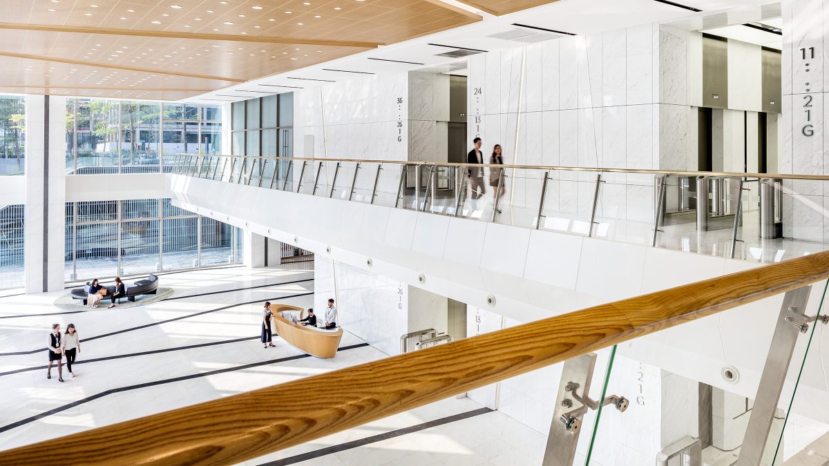 people walking on first floor with view of reception below