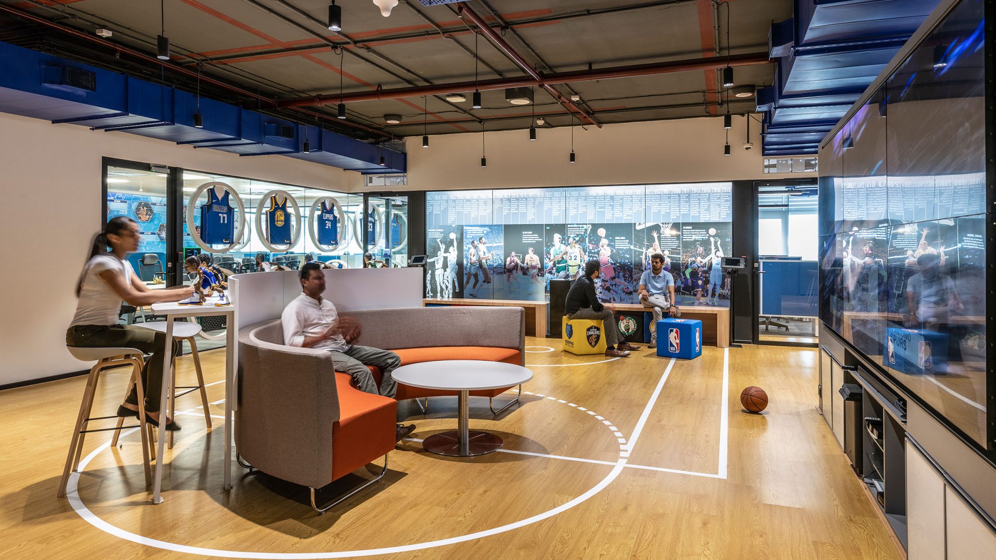 Immersive workplace design by M Moser in Mumbai for NBA featuring a fully branded employee experience.