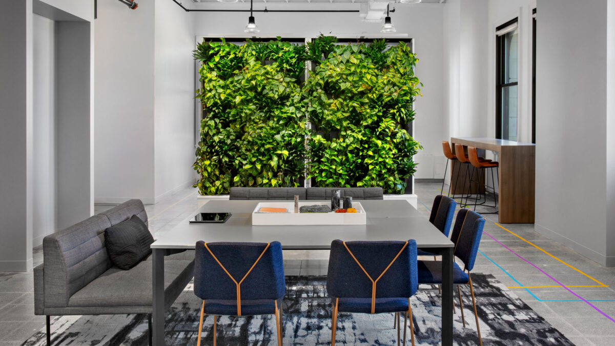 desk, chair and plant wall