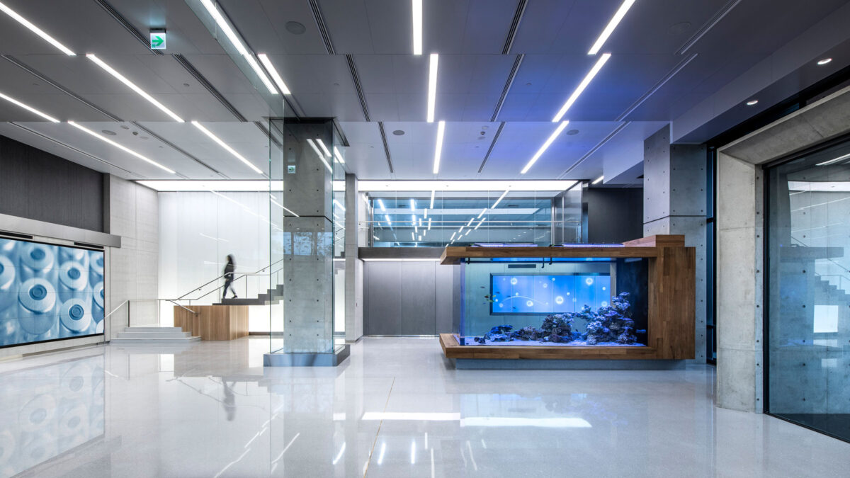 woman walking down staircase to lobby