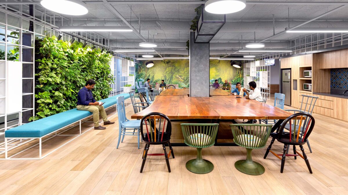 people at tables in kitchen area