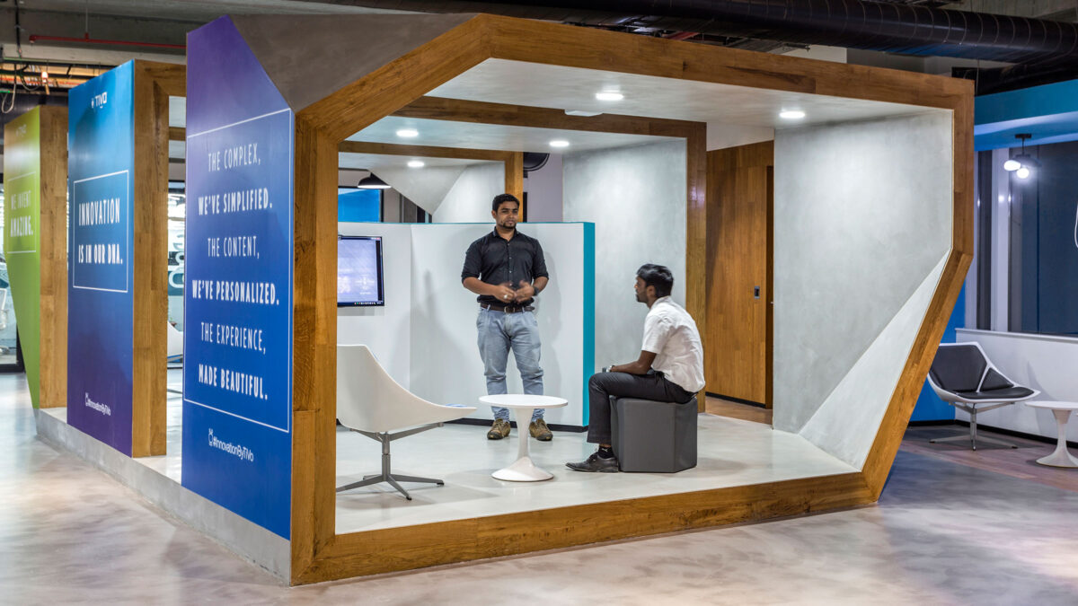 man presenting to man in booth