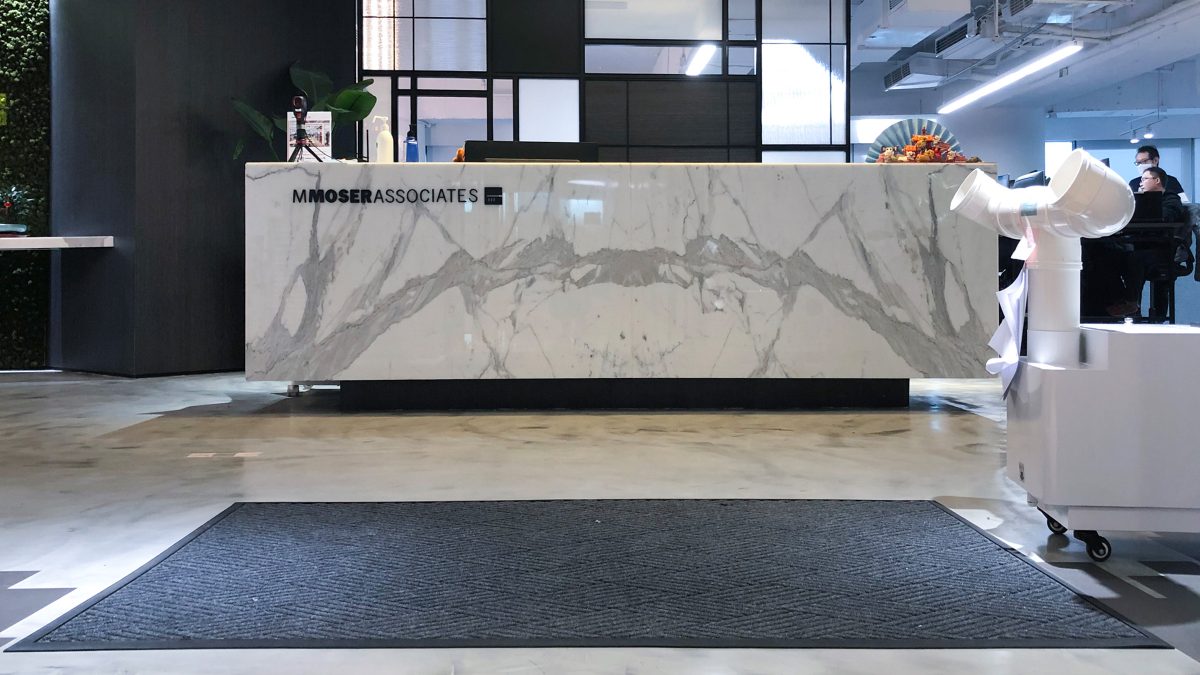reception desk with cleaning disinfectant on counter