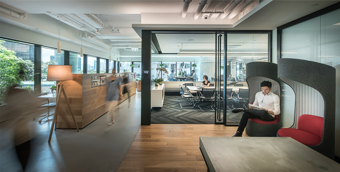 Man sitting down working view of meeting room