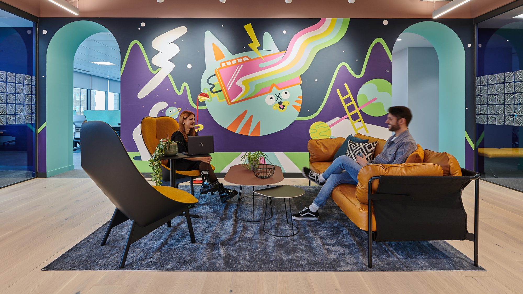 people collaborating in breakout area