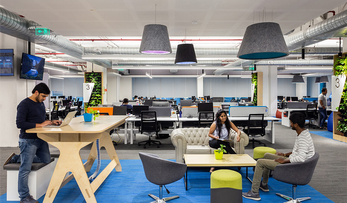 people collaborating and man working at desk