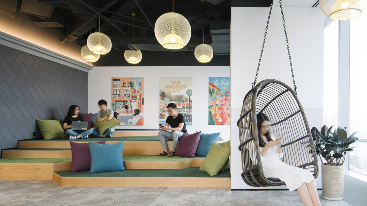 light and airy collaboration space with hanging chair