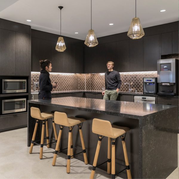 Corporate kitchen and office design by M Moser featuring break out amenity space for employees and guests.