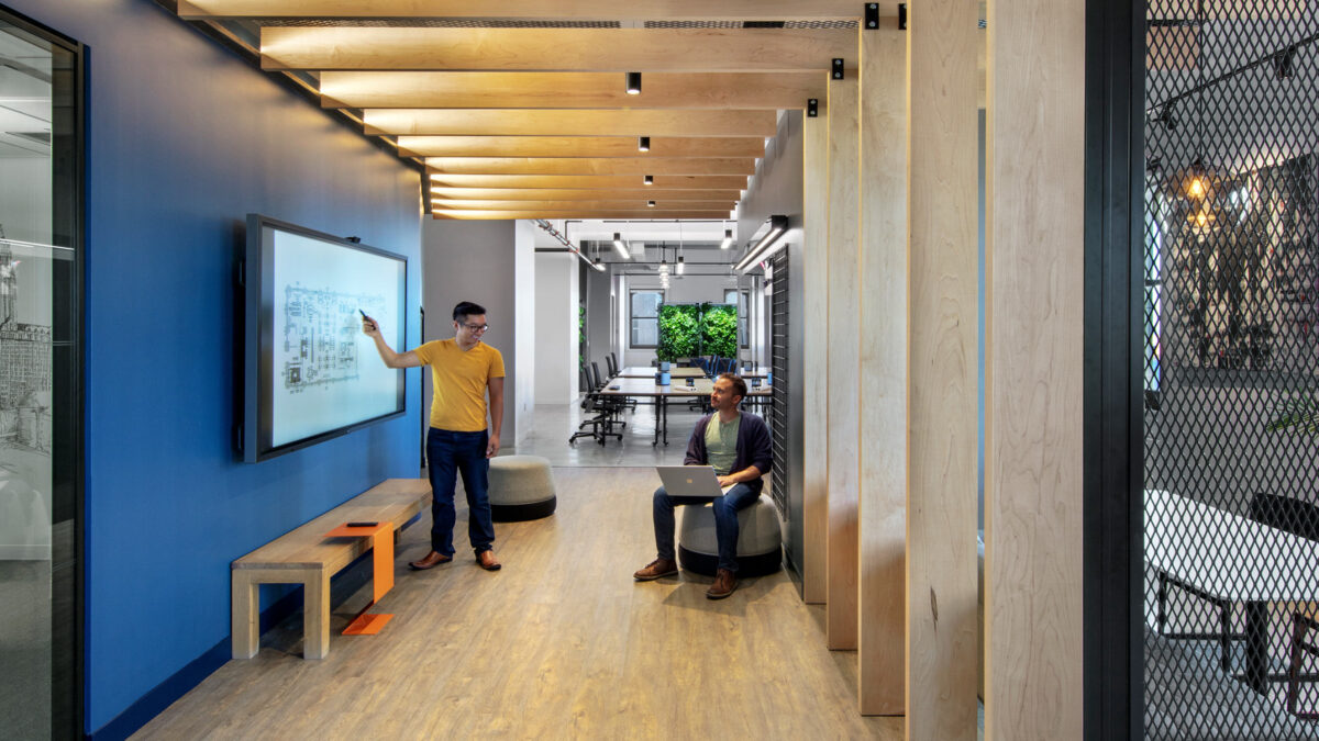 people collaborating using interactive screen, Toronto workplace design