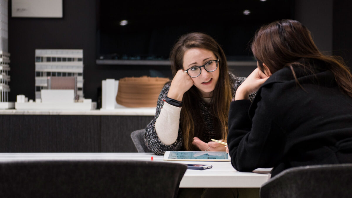 women talking in meeting