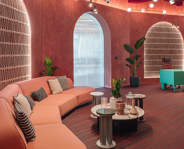 lounge  with pink furniture, pink walls and reception desk