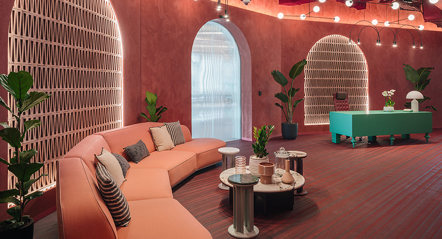 lounge  with pink furniture, pink walls and reception desk