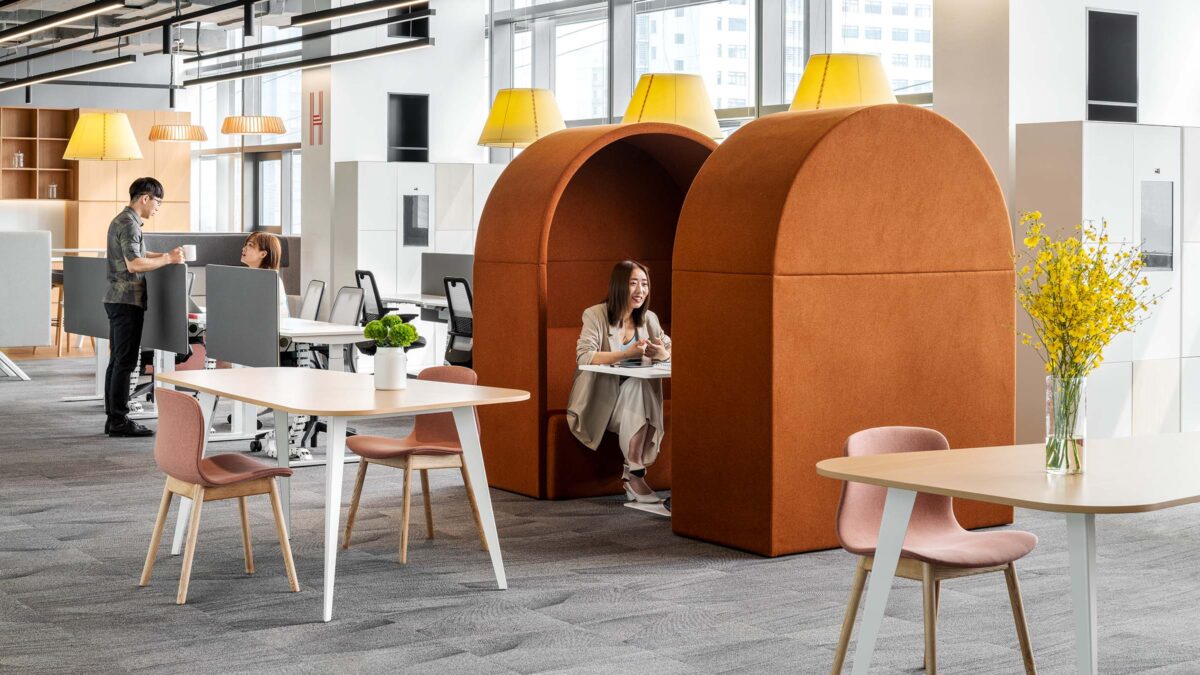 woman in booth, man and woman collaborating