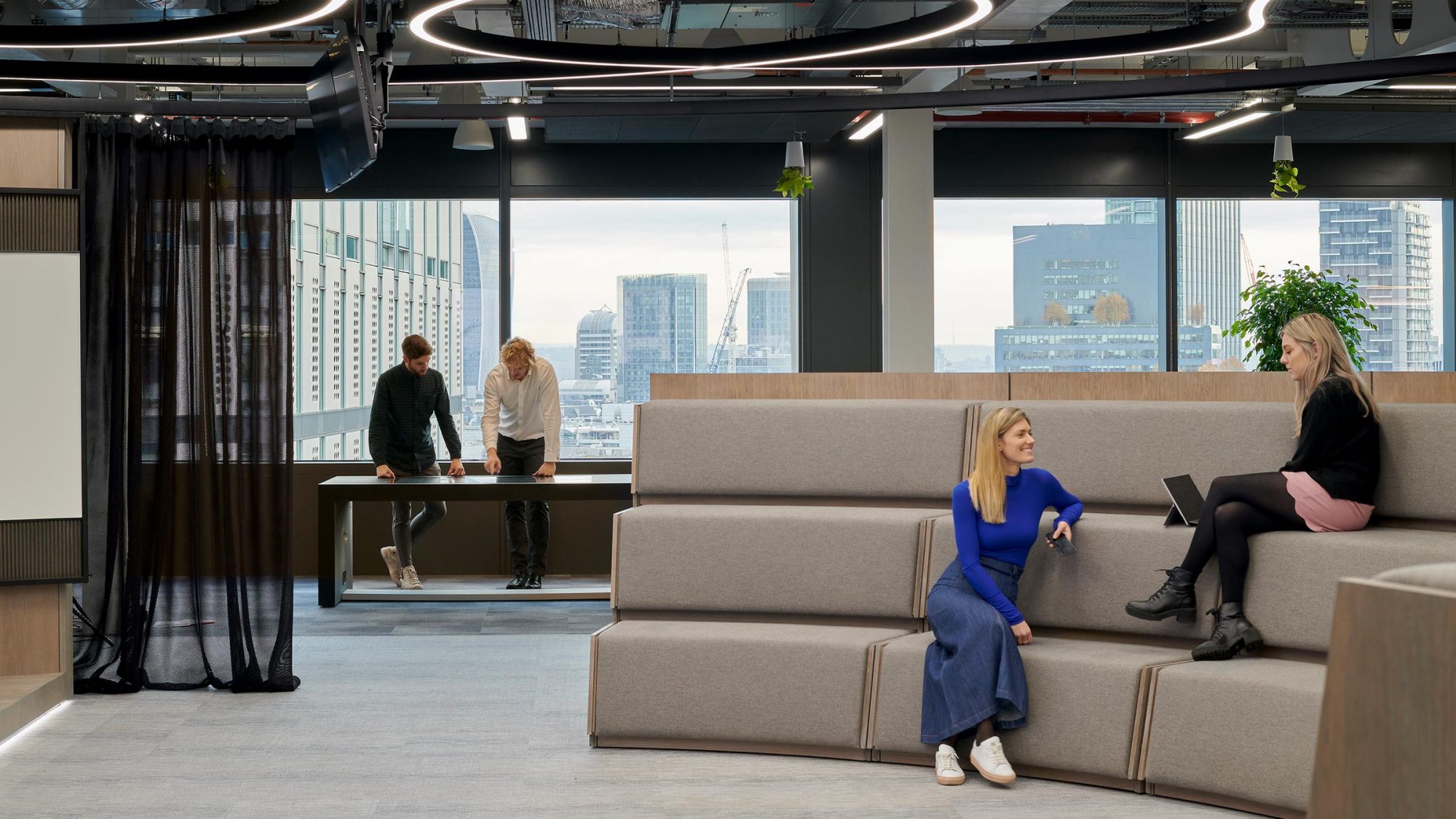 women collaborating on tiered seats