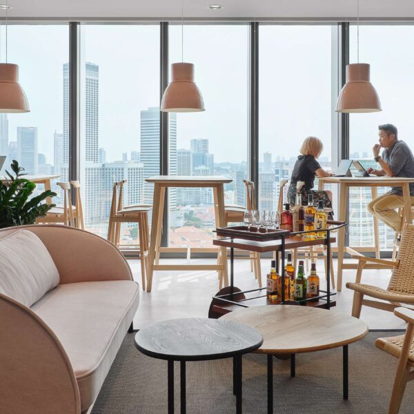 people working at desks with visible drinks