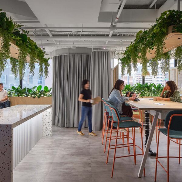 People in kitchen area and women at table