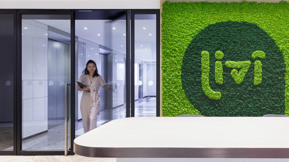 reception desk and green wall