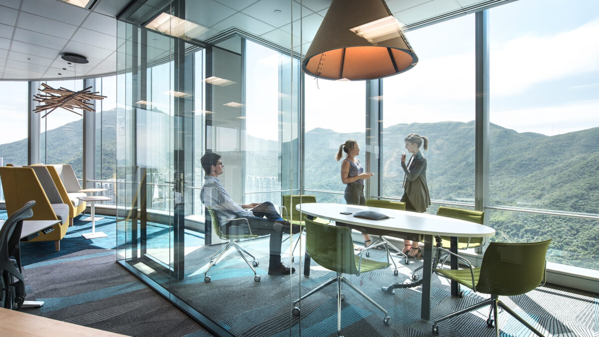 two women talking in meeting room