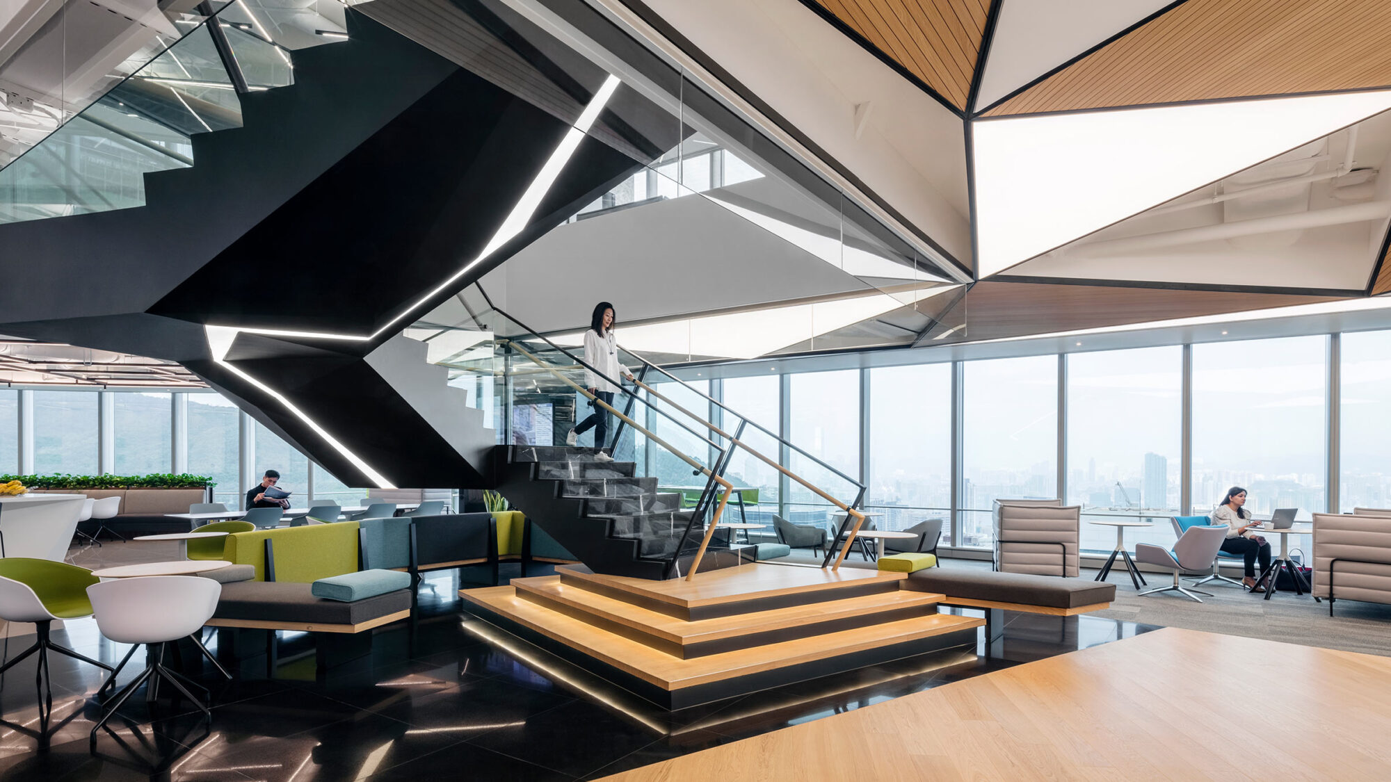 woman walking down angular staircase