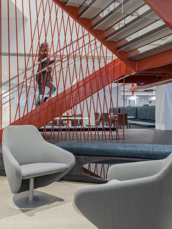 staircase with red string artwork connecting floors