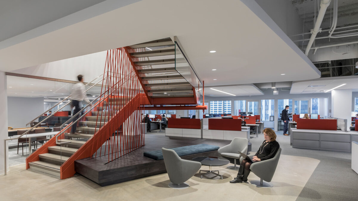 lounge seating at bottom of staircase in office