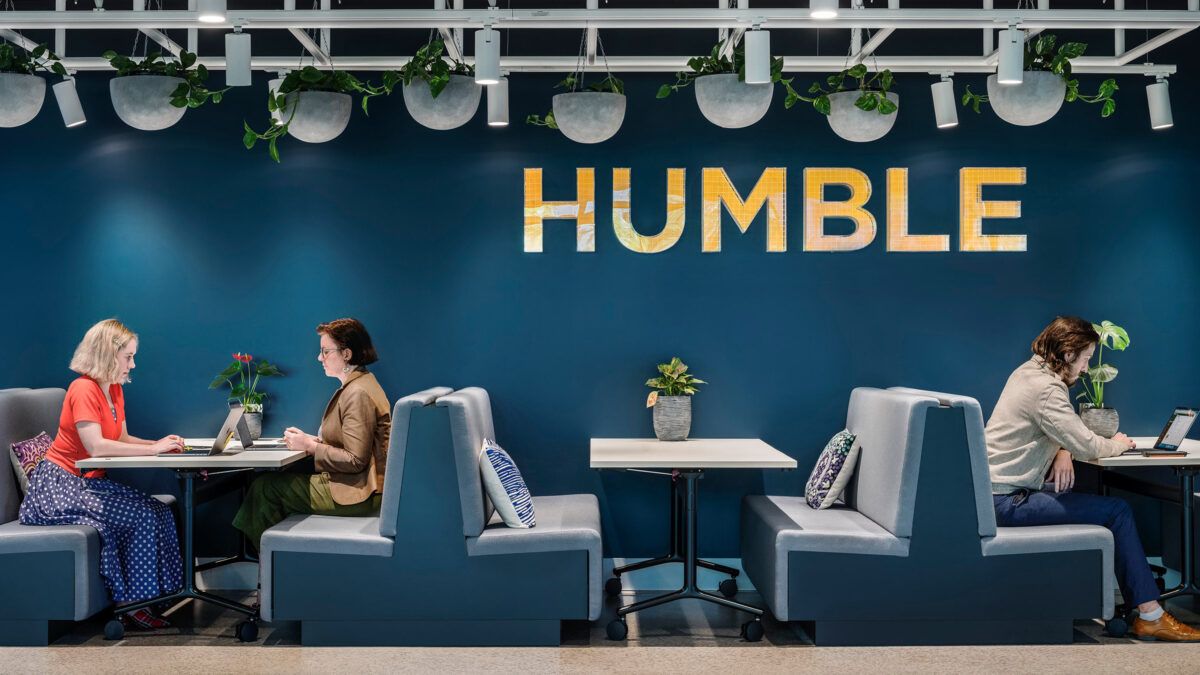 dark booth seating with logo saying humble