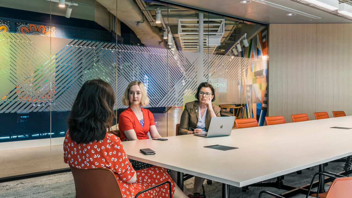 women talking in meeting room