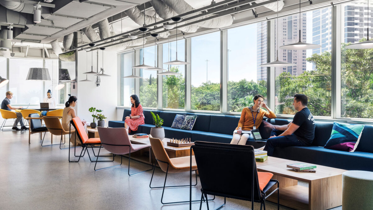 people sitting in lounge space beside window