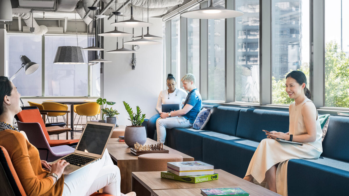 people sitting in lounge space beside window