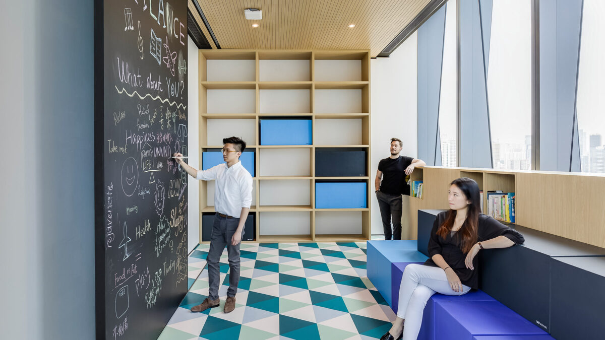 people in office using collaboration board