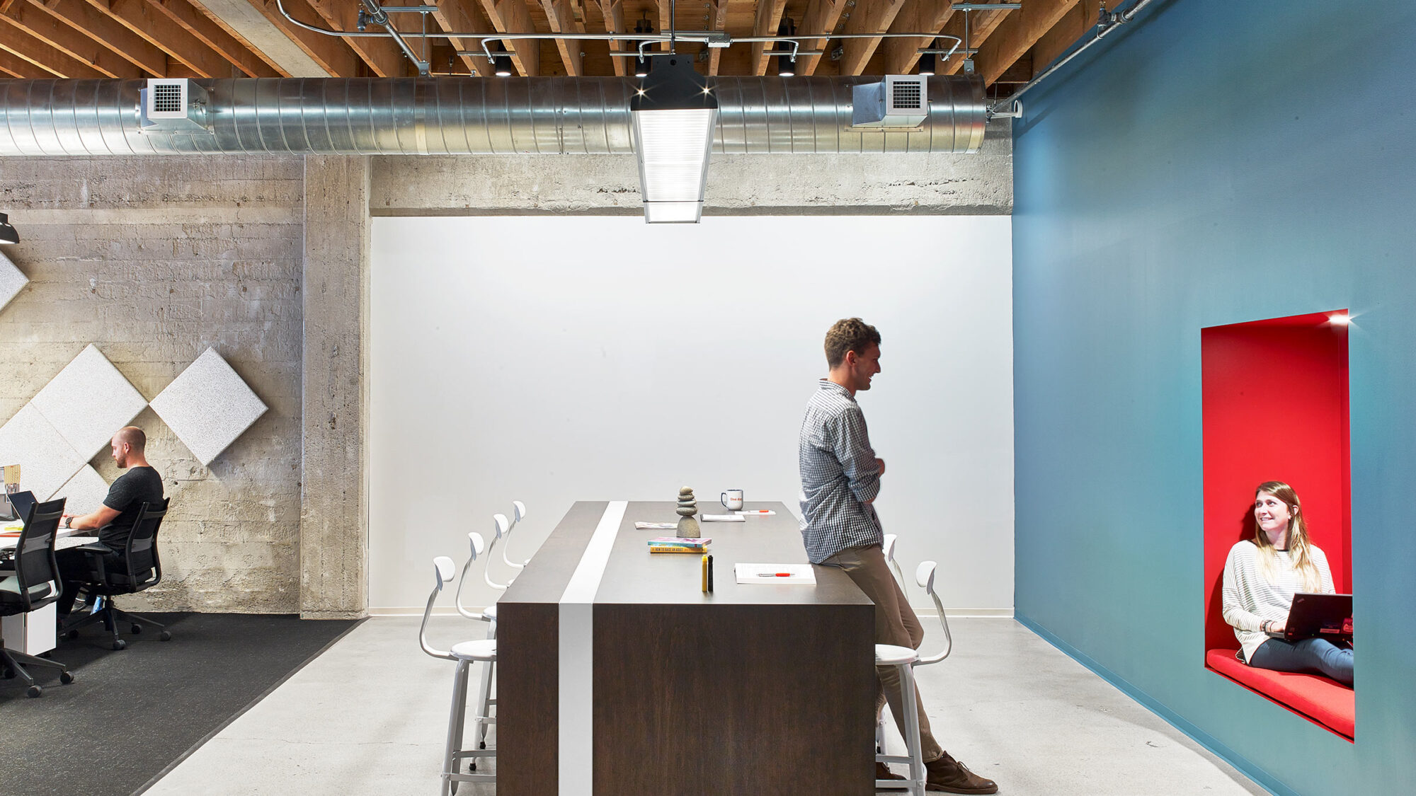 man talking to woman sitting in pod