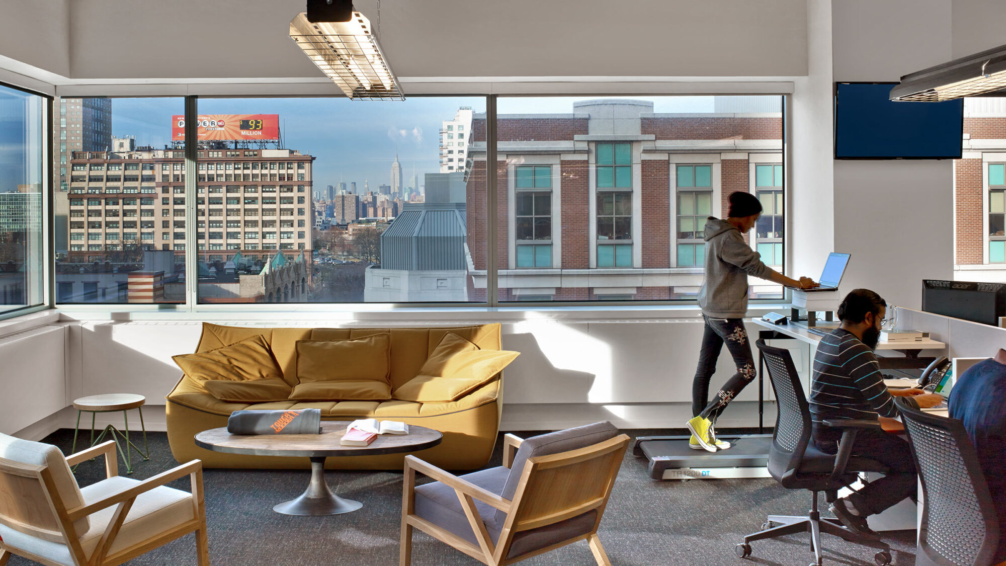 man working at treadmill office desk