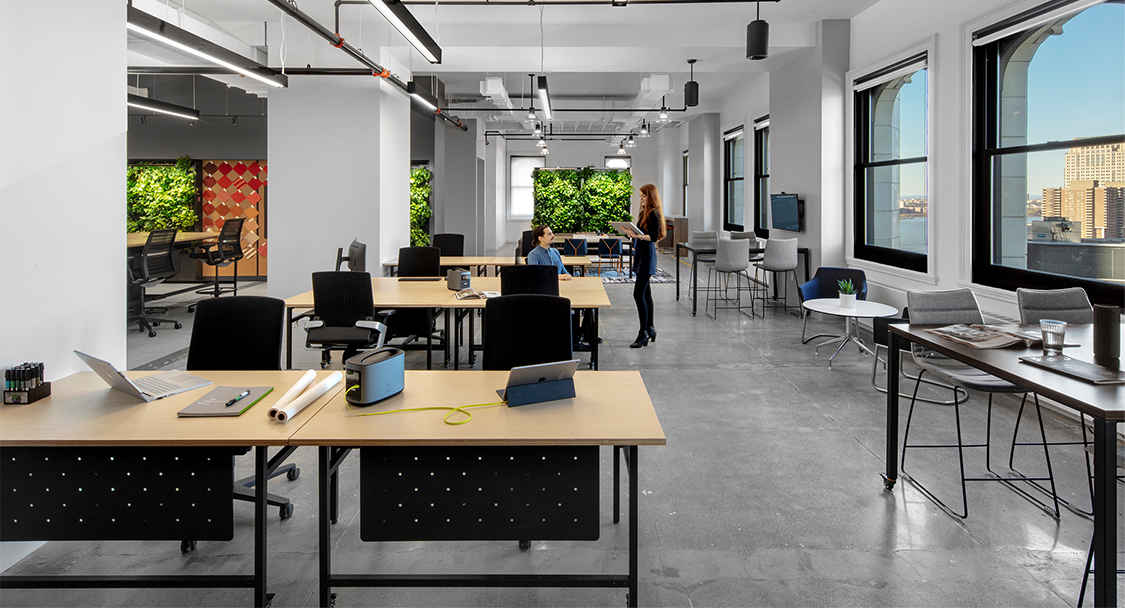 people collaborating in open plan office