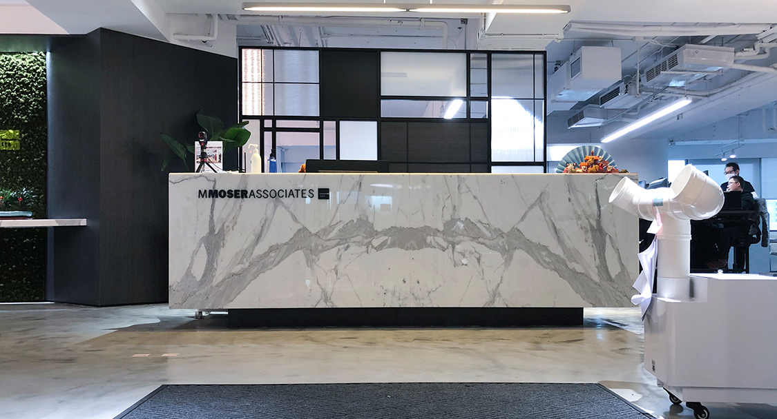 reception desk with cleaning disinfectant on counter
