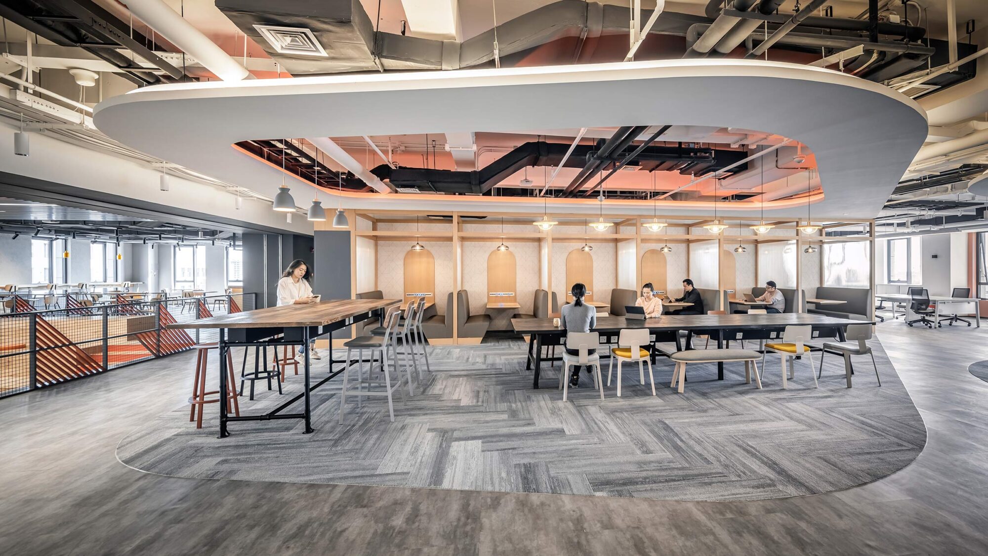 people working in open space at desks