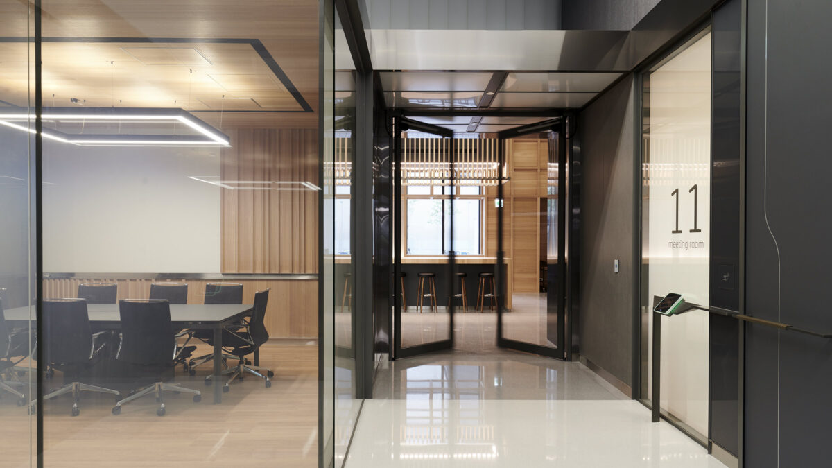 meeting room and doors opening to reveal casual seating area