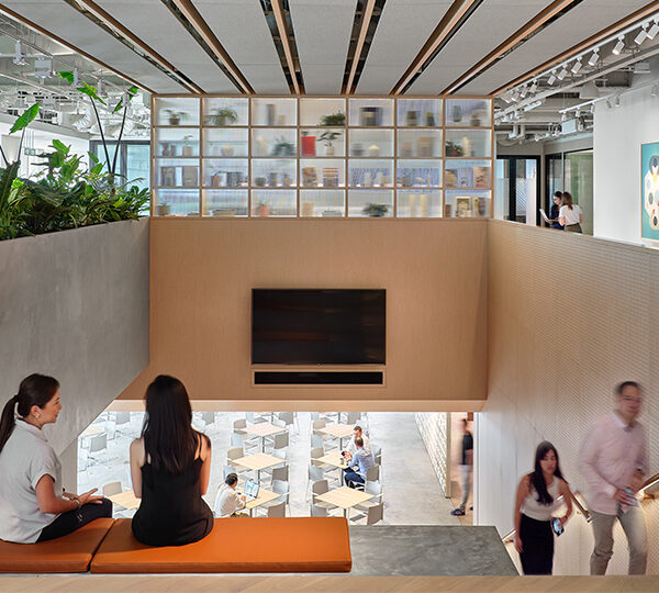 women collaborating and people walking up stairs