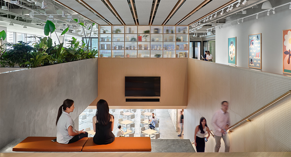 women collaborating and people walking up stairs