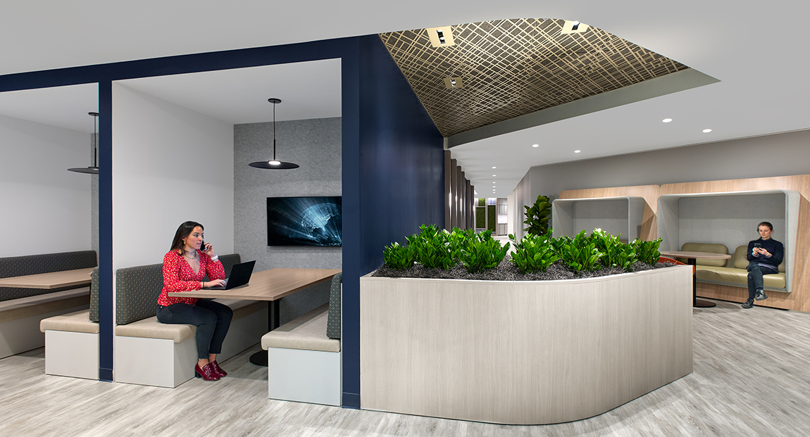 woman in booth and woman in casual seating area