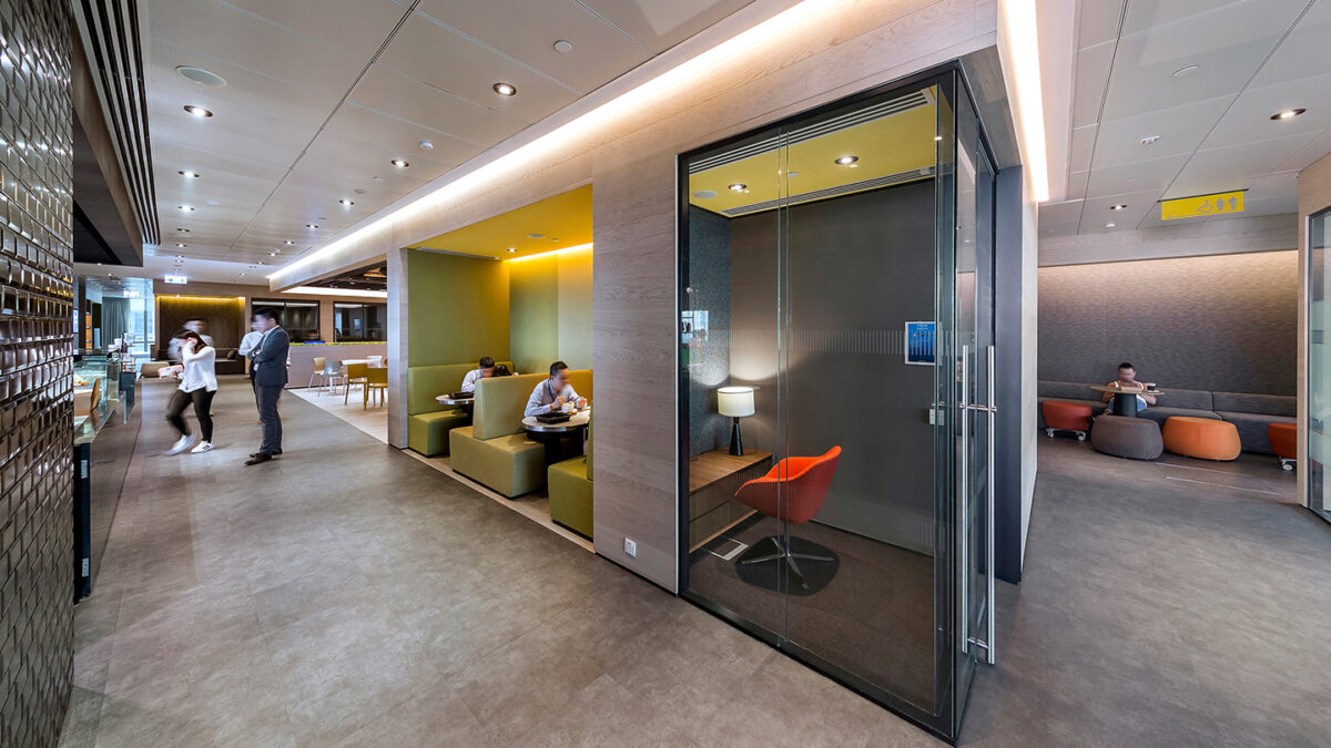 people collaborating in booths and in the kitchen