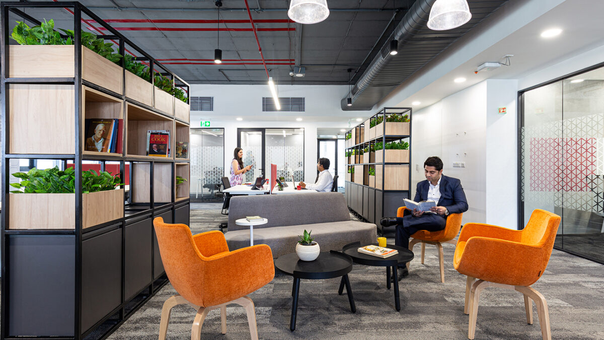 man working in open seated area