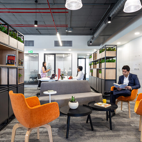 man working in open seated area